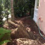 Trenching in difficult lava rock.