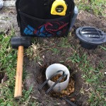 Going the extra mile when installing well light, coming up with a creative solution of using a pvc base, set on gravel, for added stability and protection.